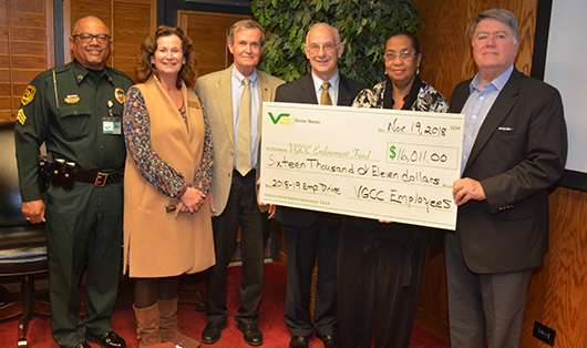 VGCC’s Faculty & Staff Drive leaders present a big symbolic check to the Endowment Fund