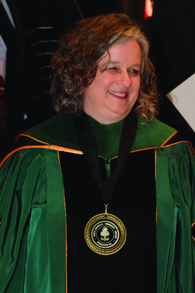 Photo of Dr. Desmarais in graduation robe