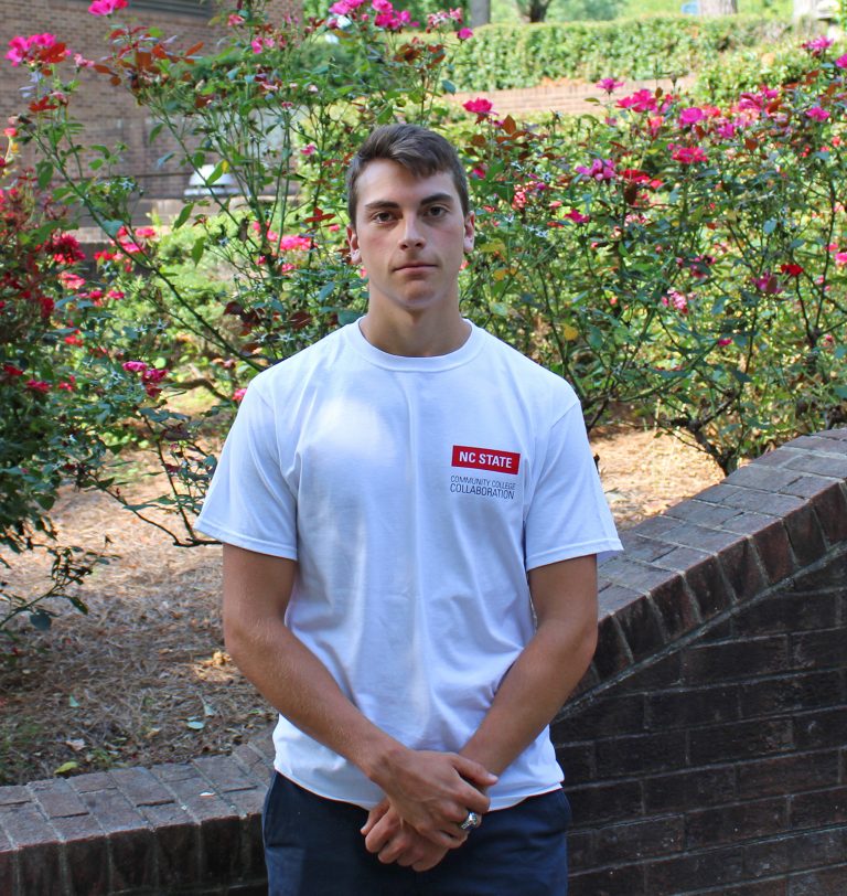 Former VGCC Student Ethan Cole in front of Rose bushes