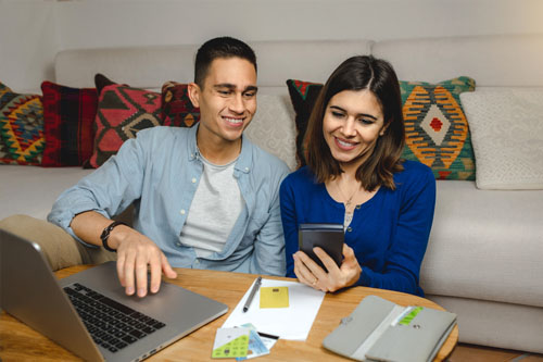 male and female couple looking over finances 