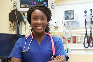 Nurse standing in wearing a stethoscope around her neck.