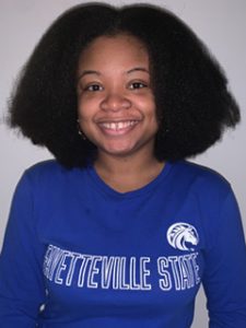 Portrait of Anautica Wilson wearing a blue Fayetteville State shirt