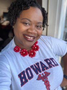 Portrait of Dr. Erica Flemming wearing a Howard University tee-shirt