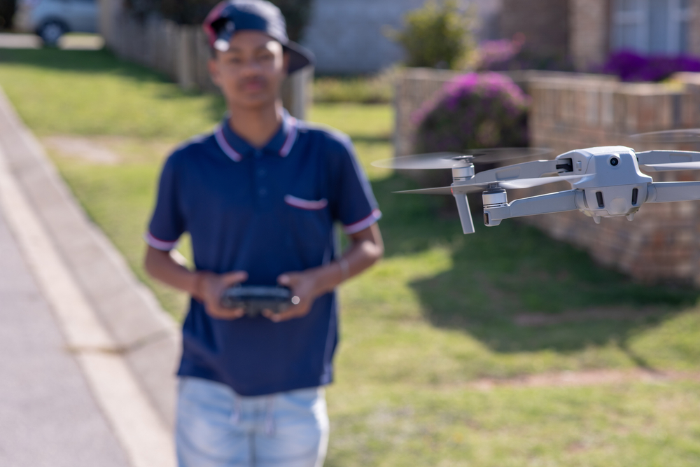 Teen flying a drone