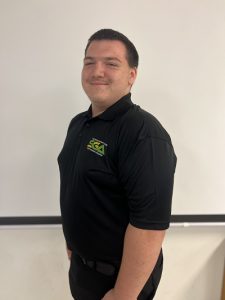 Hunter Tanner smiling while wearing a Student Government Association Polo.