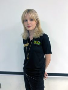 Marie O'Donoghue smiling while wearing a Student Government Association Polo.
