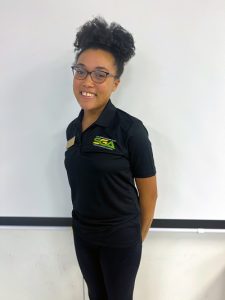 Tia Evans smiling while wearing a Student Government Association Polo.