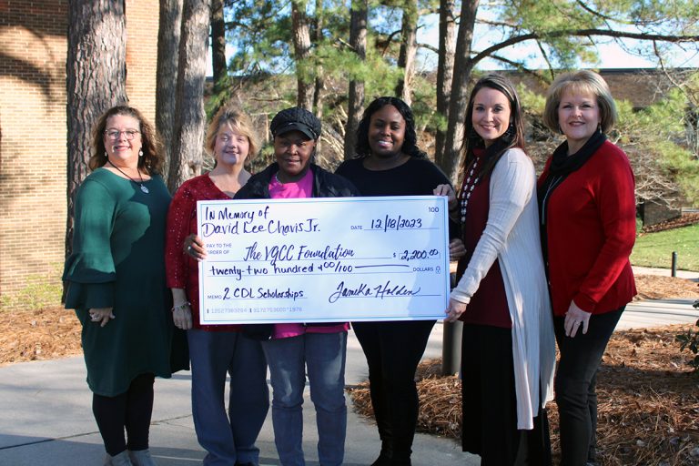 Representatives of Vance-Granville Community College and the VGCC Foundation receive a scholarship donation from the family of David Lee Chavis Jr.