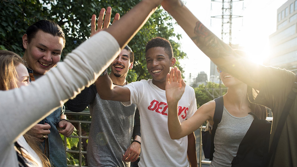 High School students giving each other high fives