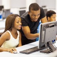 Image of college students at computer