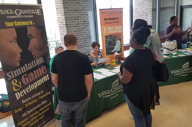 VGCC's Open house with students talking to faculty and staff about programs