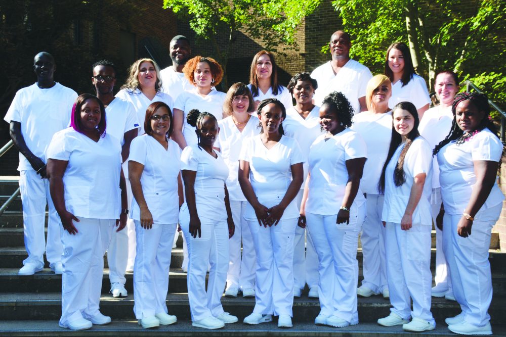 Group of Nurses on campus steps
