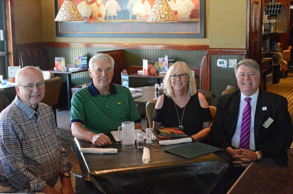 Eddie Ferguson sits with friends to discuss scholoarship plans