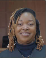 a young smiling woman representing business members.