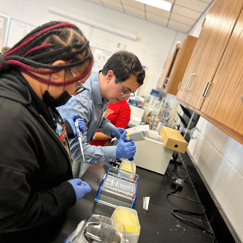 VGCC instructor for Bioprocess/Biotechnology guides students during a lab exercise