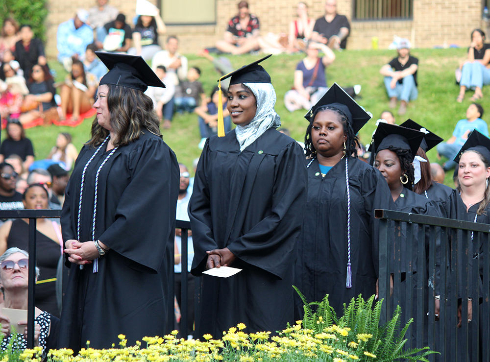 Graduates lined up waiting to cross the stage.