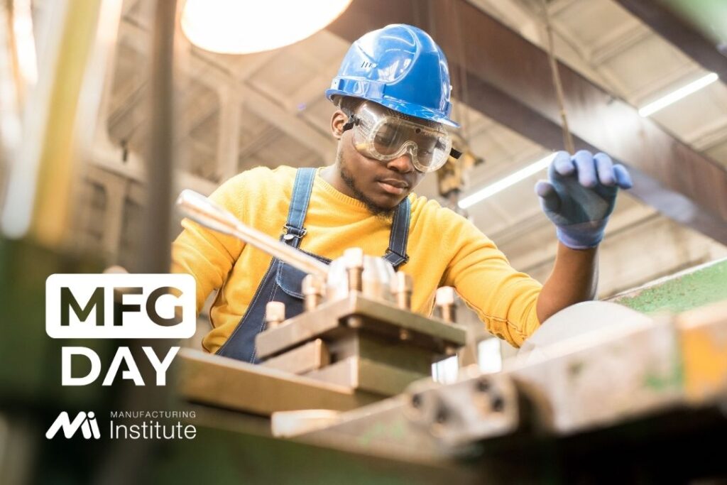 A young man appears to be working on a robotic setup. The Manufacturing Institute's logo fills the lower left corner.
