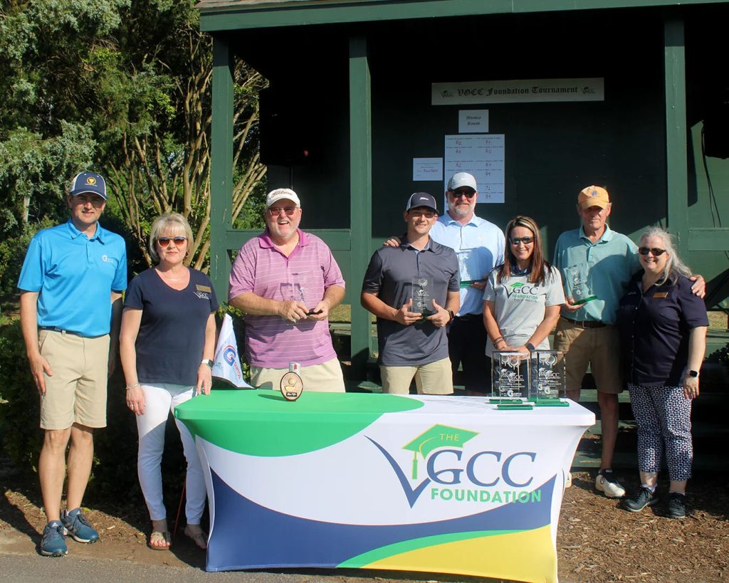 The VGCC Foundation presents awards to winning golfers at Henderson Country Club