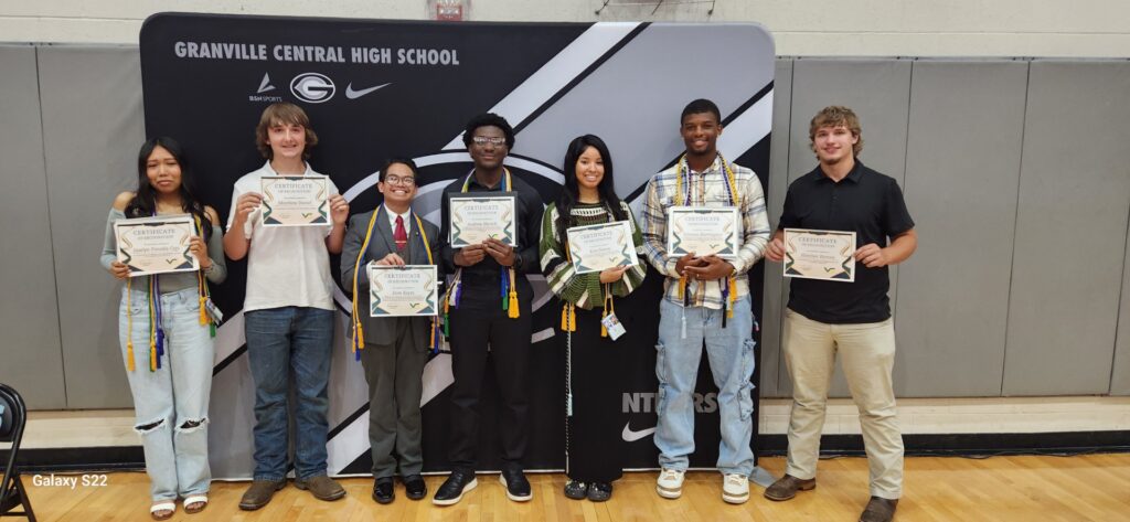 CCP Students holding certificates.
