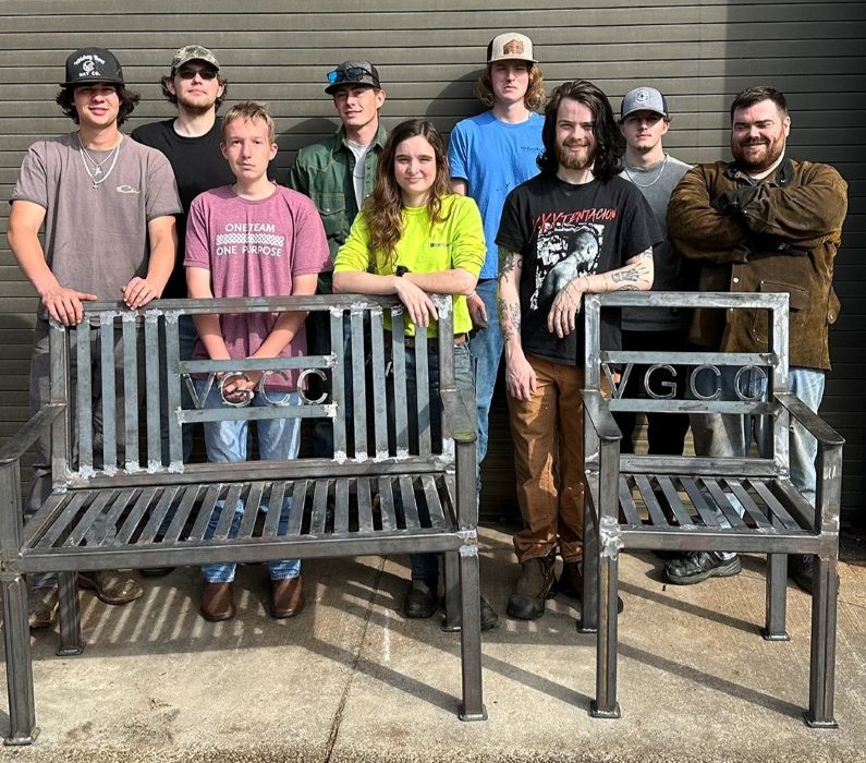 VGCC Welding students pose with furniture they created for The VGCC Foundation.
