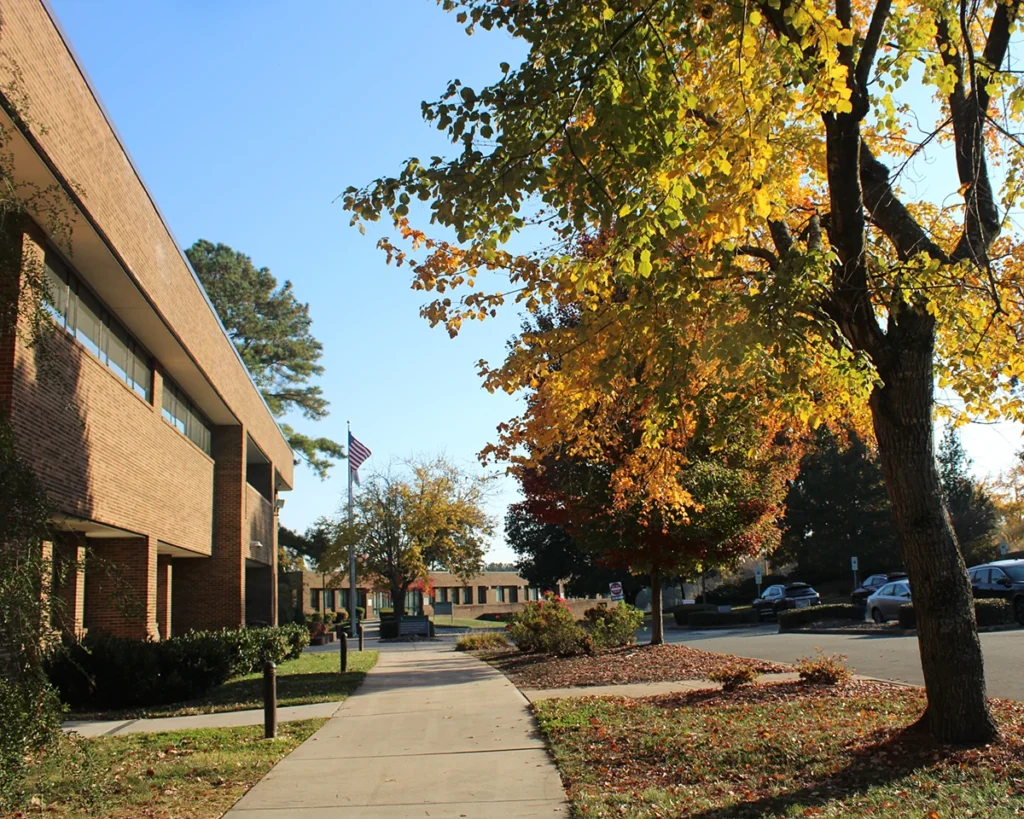 Exterior photo of VGCC Main Campus Building 1 on an autumn afternoon