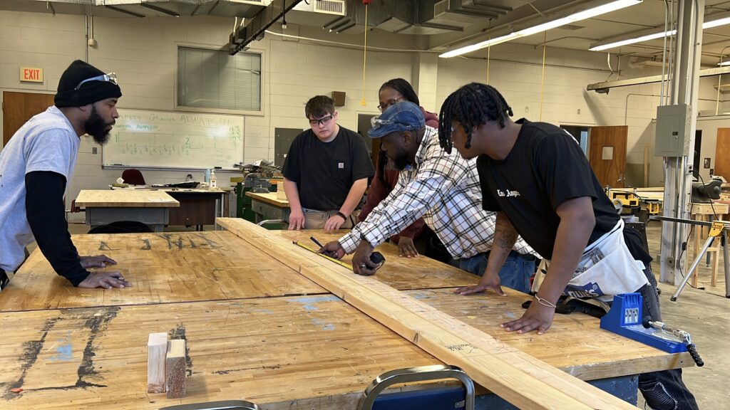 CCP Carpentry Students working in the carpentry lab area.