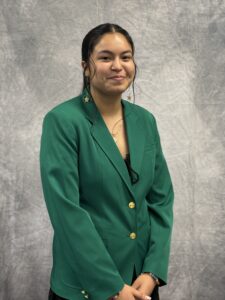 Jennifer Hernandez wearing a green VGCC Ambassadors coat.