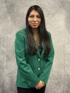 Kimberly Flores Maus wearing a green VGCC Ambassadors coat.
