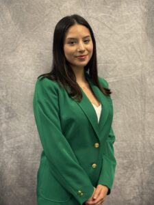 Mariana Figueroe Bonilla wearing a green VGCC Ambassadors coat.