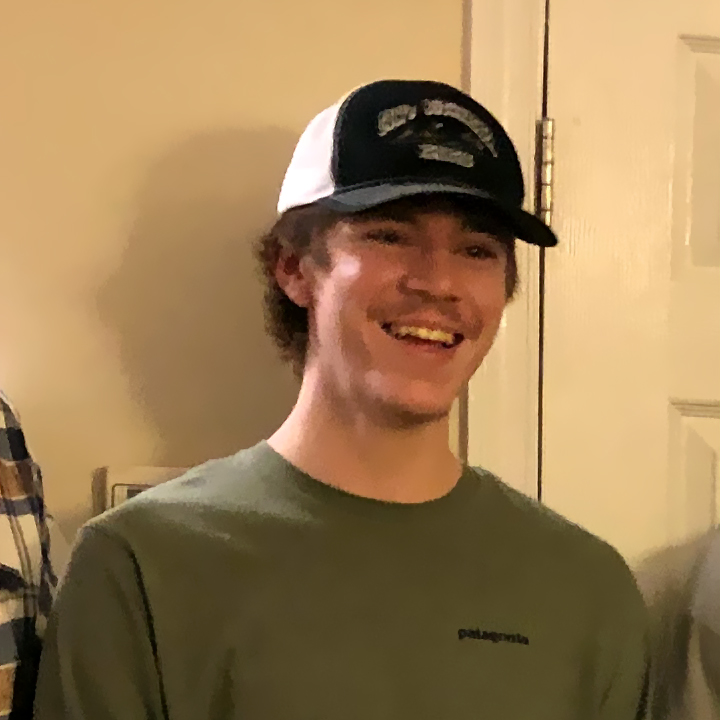 Casual photo of a smiling young man wearing a baseball cap and long-sleeved T-shirt [Spencer Blalock]